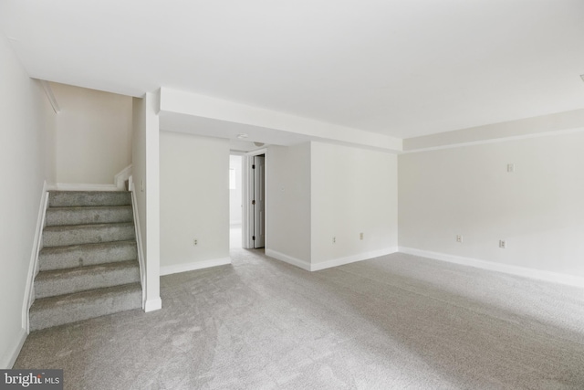 12473 Turtle Dove Pl, Waldorf, MD 20602 - unfurnished living room with carpet, stairway, and baseboards