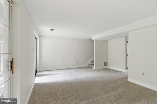 12473 Turtle Dove Pl, Waldorf, MD 20602 - spare room featuring stairway, light colored carpet, and baseboards