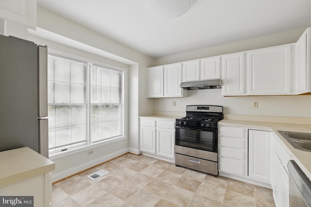 12473 Turtle Dove Pl, Waldorf, MD 20602 - kitchen featuring stainless steel appliances, under cabinet range hood, white cabinets, and baseboards