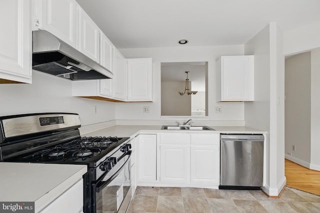 12473 Turtle Dove Pl, Waldorf, MD 20602 - kitchen with appliances with stainless steel finishes, wall chimney range hood, a sink, and light countertops