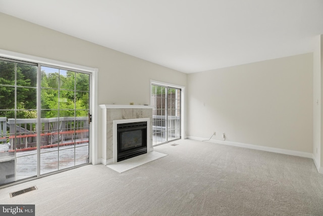12473 Turtle Dove Pl, Waldorf, MD 20602 - unfurnished living room with a fireplace, carpet floors, and baseboards