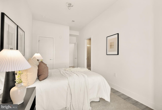 1001 Rhode Island Ave NE Unit 101, Washington, DC 20018 - bedroom with wood finished floors and baseboards