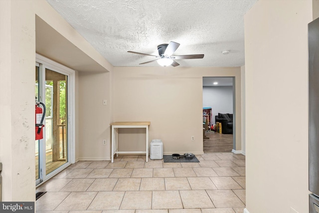 2 Bunting Bridge Rd, Cookstown, NJ 08511 - empty room featuring a textured ceiling, ceiling fan, light tile patterned floors, baseboards, and a smoke detector