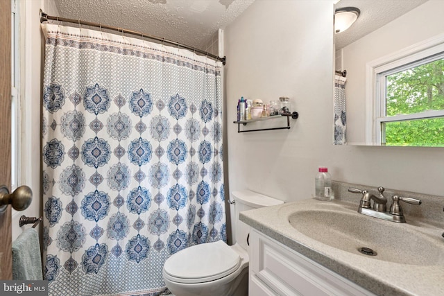 2 Bunting Bridge Rd, Cookstown, NJ 08511 - bathroom featuring a textured ceiling, toilet, vanity, and a shower with shower curtain