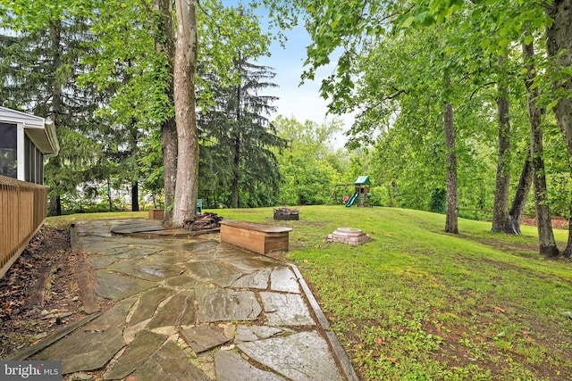 2 Bunting Bridge Rd, Cookstown, NJ 08511 - view of green lawn featuring a playground and a patio area