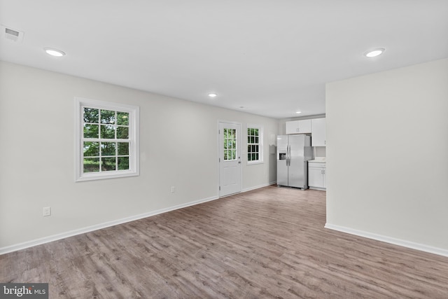 23167 File Rd, Bowling Green, VA 22427 - unfurnished living room featuring light wood-type flooring, plenty of natural light, and recessed lighting