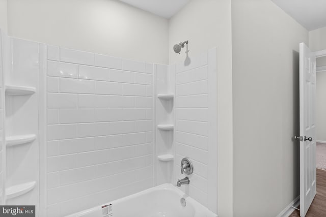23167 File Rd, Bowling Green, VA 22427 - full bath with shower / bath combination and wood finished floors