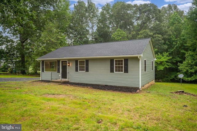 23167 File Rd, Bowling Green, VA 22427 - view of front facade with a front lawn and roof with shingles