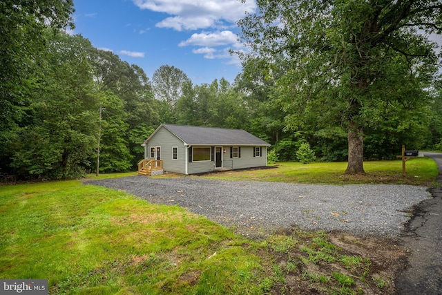 23167 File Rd, Bowling Green, VA 22427 - view of front of home with driveway and a front lawn