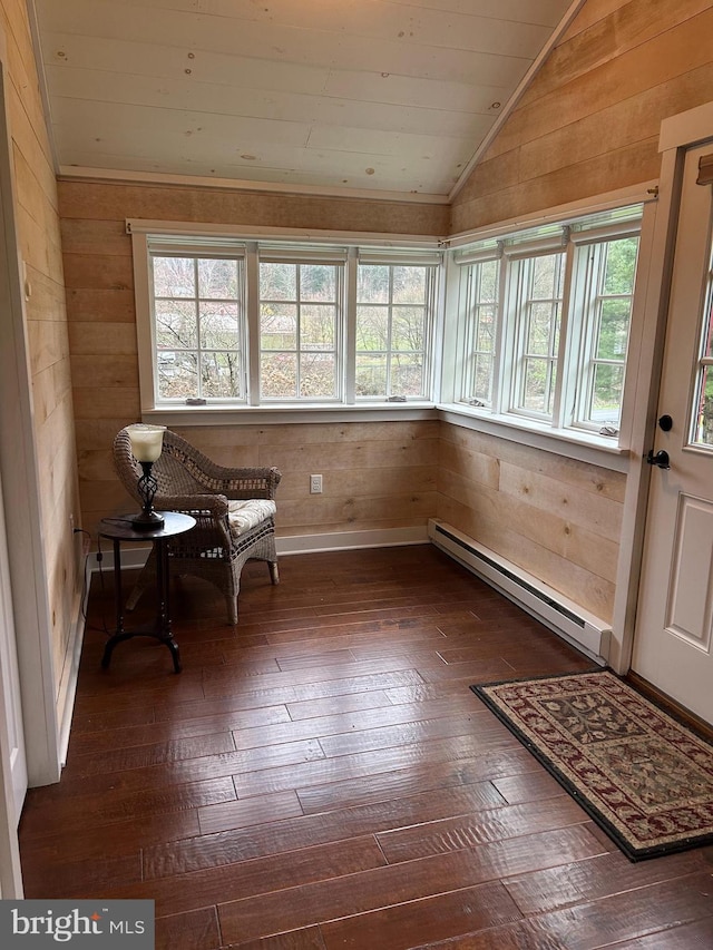 unfurnished sunroom featuring a baseboard radiator