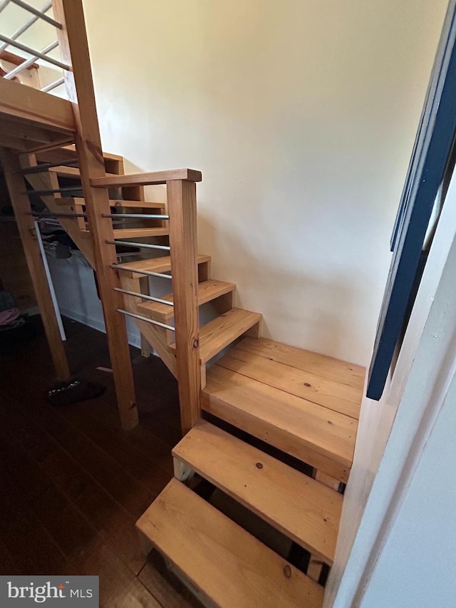 stairs with wood-type flooring