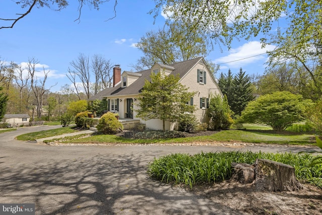 view of home's exterior with a chimney