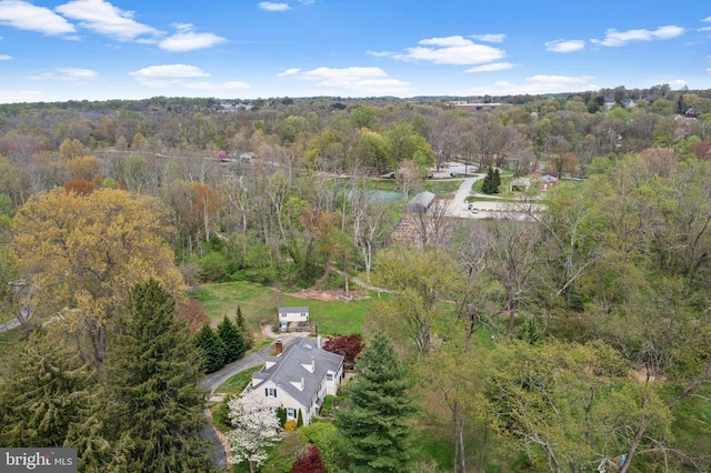 aerial view with a wooded view