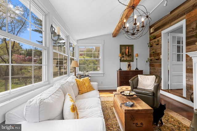 sunroom with a notable chandelier