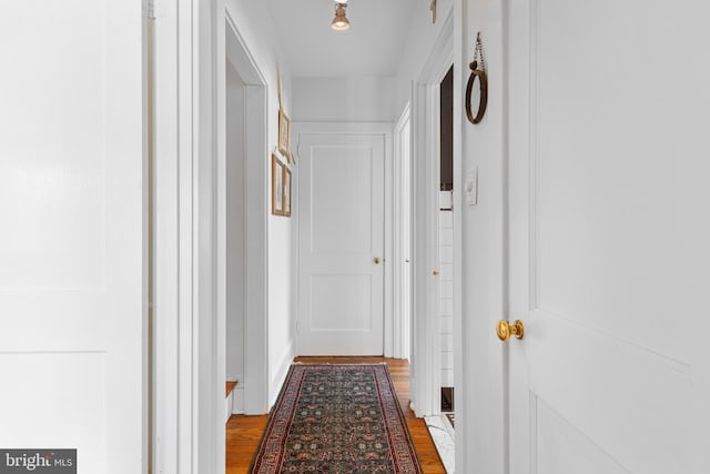 corridor with wood finished floors