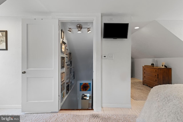 bedroom with lofted ceiling