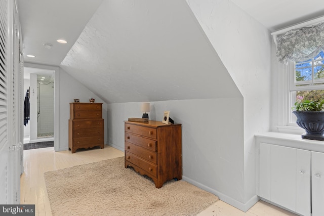 bonus room with light wood-style floors, baseboards, lofted ceiling, and recessed lighting