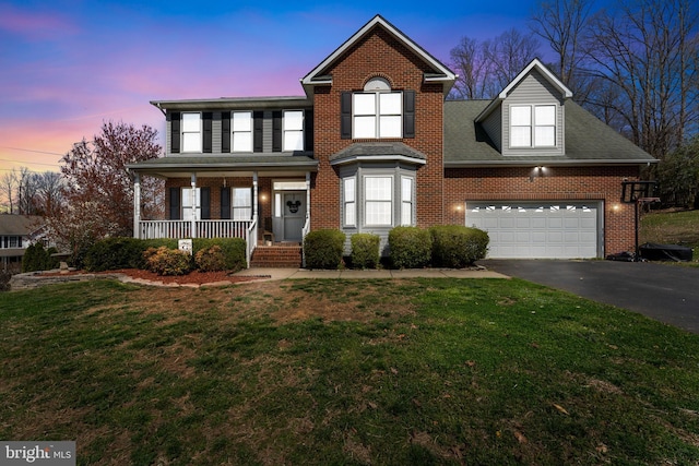 3 Oleander Dr, Stafford, VA 22554 - traditional-style house with a yard, brick siding, aphalt driveway, and covered porch