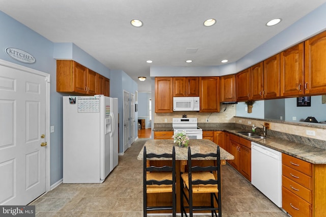 3 Oleander Dr, Stafford, VA 22554 - kitchen with brown cabinets, white appliances, recessed lighting, and a sink