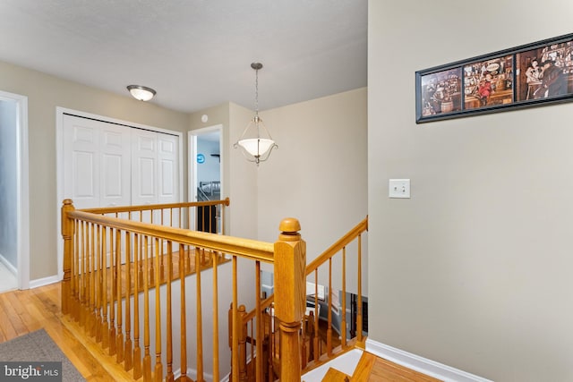 3 Oleander Dr, Stafford, VA 22554 - hall featuring baseboards, light wood-style floors, and an upstairs landing