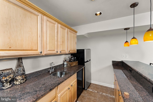 3 Oleander Dr, Stafford, VA 22554 - kitchen with freestanding refrigerator, light brown cabinets, dishwasher, a sink, and dark tile patterned floors