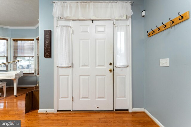 3 Oleander Dr, Stafford, VA 22554 - foyer featuring crown molding, light wood-style floors, and baseboards