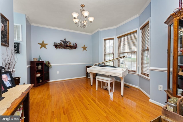 3 Oleander Dr, Stafford, VA 22554 - dining room featuring baseboards, crown molding, an inviting chandelier, and light wood-type flooring