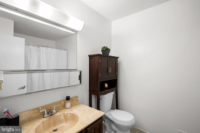 1949 Catoctin Ter, Silver Spring, MD 20906 - bathroom featuring vanity, toilet, and baseboards