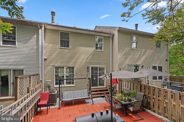 1949 Catoctin Ter, Silver Spring, MD 20906 - back of property with a patio area, fence, entry steps, and cooling unit