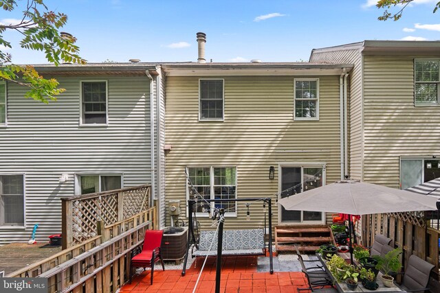 1949 Catoctin Ter, Silver Spring, MD 20906 - back of house featuring a patio, central AC unit, and fence