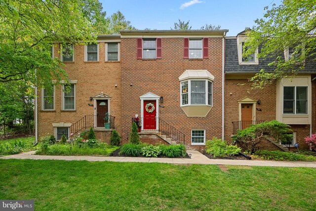 1949 Catoctin Ter, Silver Spring, MD 20906 - view of property featuring brick siding, a front lawn, and a shingled roof