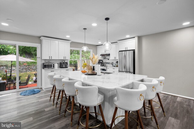 1949 Catoctin Ter, Silver Spring, MD 20906 - kitchen with appliances with stainless steel finishes, recessed lighting, plenty of natural light, and backsplash
