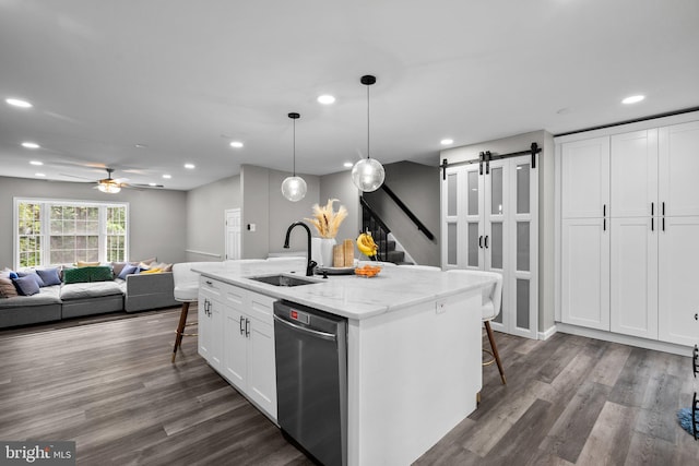 1949 Catoctin Ter, Silver Spring, MD 20906 - kitchen featuring a sink, dishwasher, a kitchen breakfast bar, recessed lighting, and white cabinets