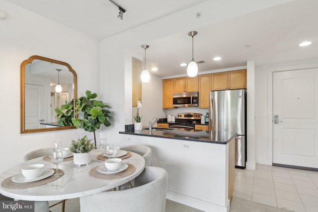 2001 15th St N Unit 207, Arlington, VA 22201 - kitchen with a sink, recessed lighting, hanging light fixtures, and appliances with stainless steel finishes