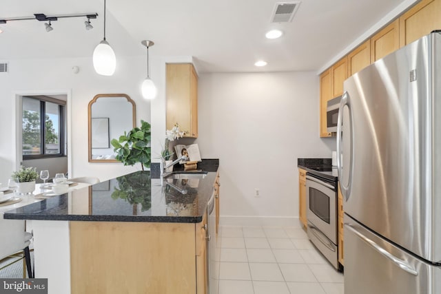 2001 15th St N Unit 207, Arlington, VA 22201 - kitchen featuring a peninsula, light tile patterned floors, stainless steel appliances, light brown cabinets, and visible vents