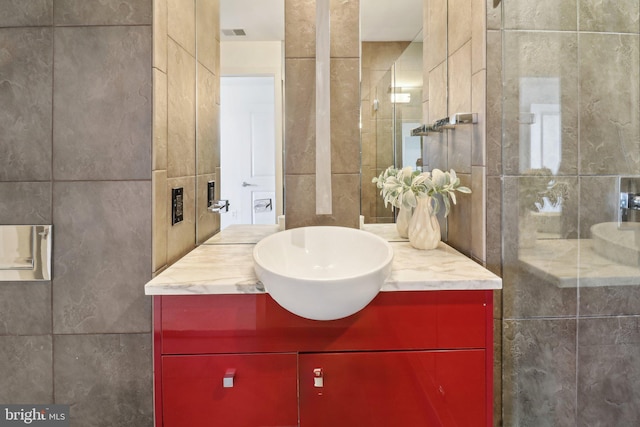 2001 15th St N Unit 207, Arlington, VA 22201 - full bath featuring vanity, tile walls, and tiled shower