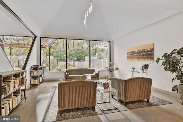living area with high vaulted ceiling