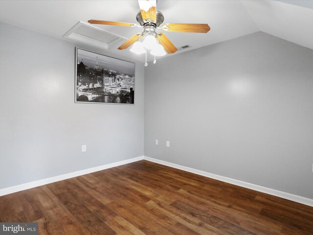 spare room with ceiling fan, wood finished floors, baseboards, and lofted ceiling