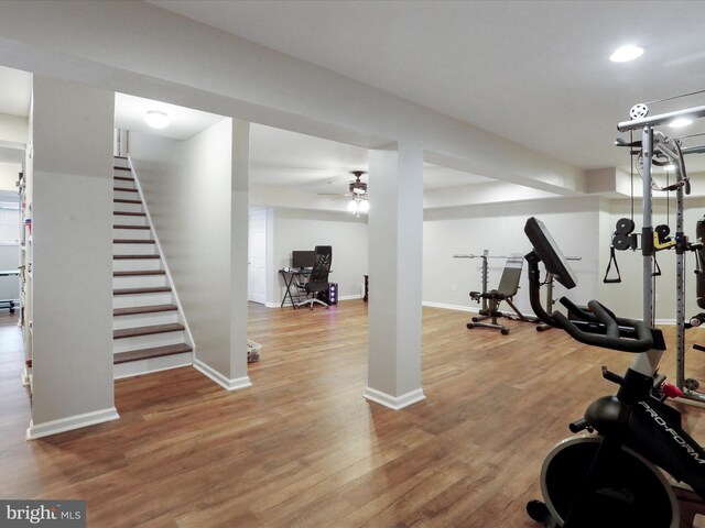 workout room featuring wood finished floors, baseboards, a ceiling fan, and recessed lighting