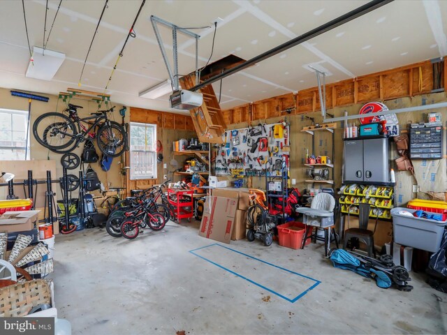 garage featuring a workshop area and a garage door opener
