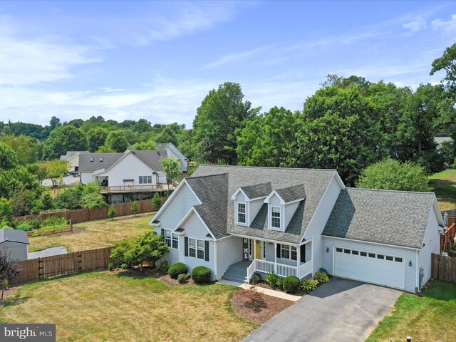 cape cod home featuring a porch, a garage, asphalt driveway, and a shingled roof