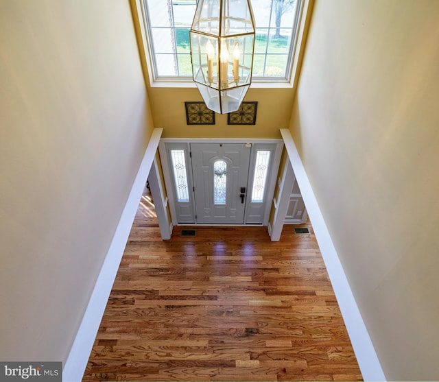 28 Autumnwood Ln, Mount Laurel, NJ 08054 - entryway with a high ceiling, a chandelier, and wood finished floors