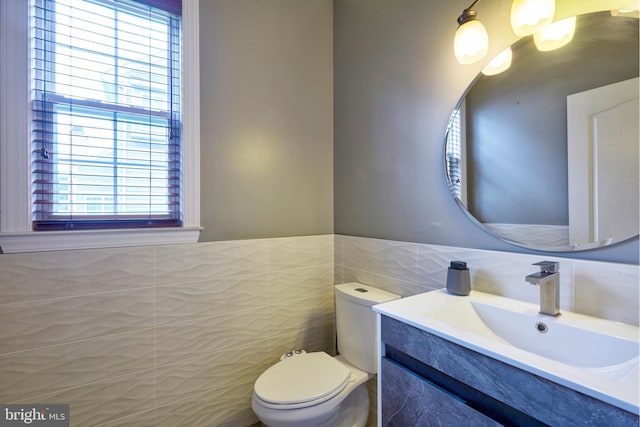 28 Autumnwood Ln, Mount Laurel, NJ 08054 - bathroom featuring tile walls, healthy amount of natural light, toilet, vanity, and wainscoting