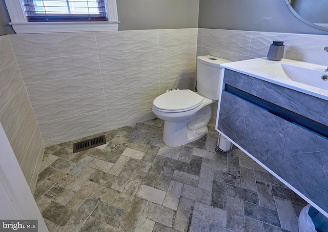 28 Autumnwood Ln, Mount Laurel, NJ 08054 - bathroom with tile walls, toilet, and vanity