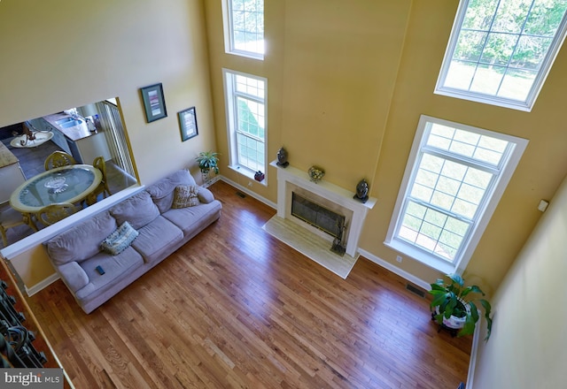 28 Autumnwood Ln, Mount Laurel, NJ 08054 - living area featuring a towering ceiling, plenty of natural light, and wood finished floors