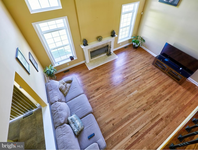 28 Autumnwood Ln, Mount Laurel, NJ 08054 - living room with healthy amount of natural light, wood finished floors, and baseboards