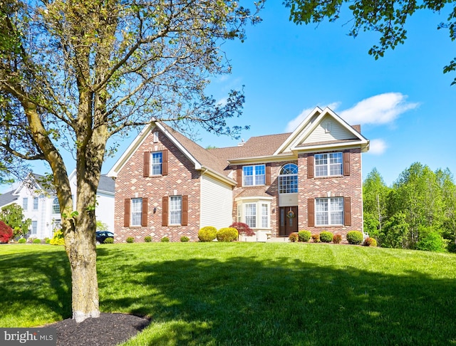 28 Autumnwood Ln, Mount Laurel, NJ 08054 - traditional home with a front yard and brick siding