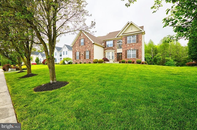 28 Autumnwood Ln, Mount Laurel, NJ 08054 - traditional-style house with brick siding and a front yard