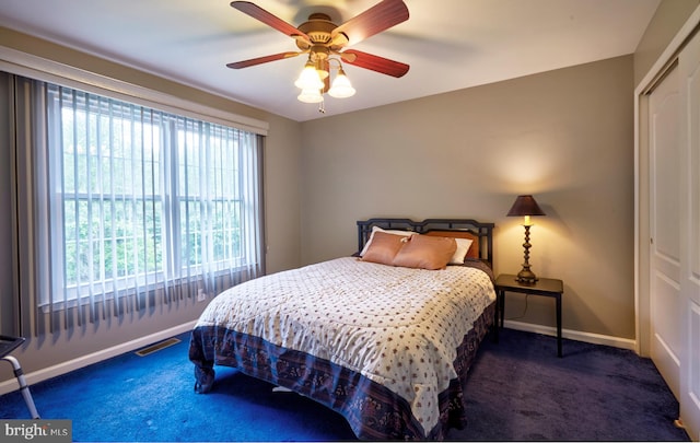 28 Autumnwood Ln, Mount Laurel, NJ 08054 - carpeted bedroom with baseboards, a closet, and a ceiling fan