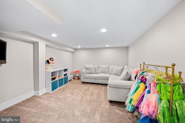 carpeted living room featuring recessed lighting and baseboards